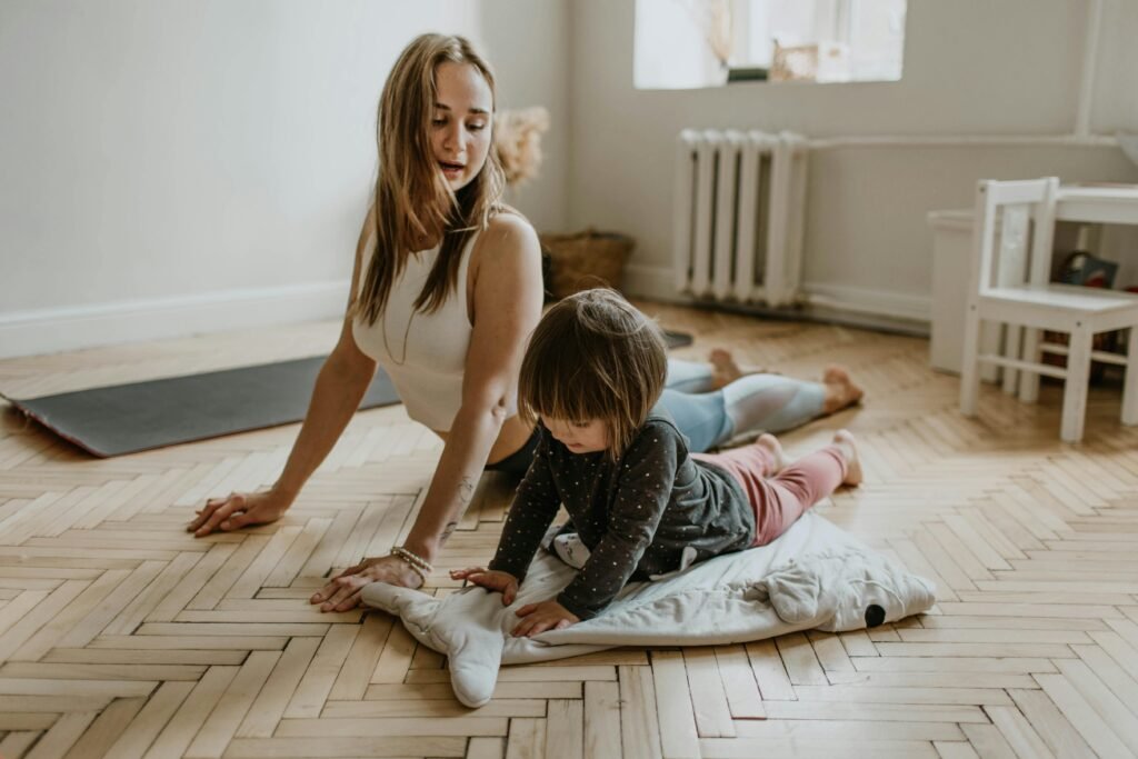 Mother and child practicing yoga together in a cozy home setting – yoga for flexibility, strength, and bonding and exercise for lose weight
